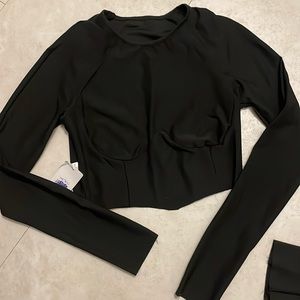 Black large track set nice form fitting. nice Quence under the breast